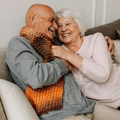 Loving senior couple on couch.