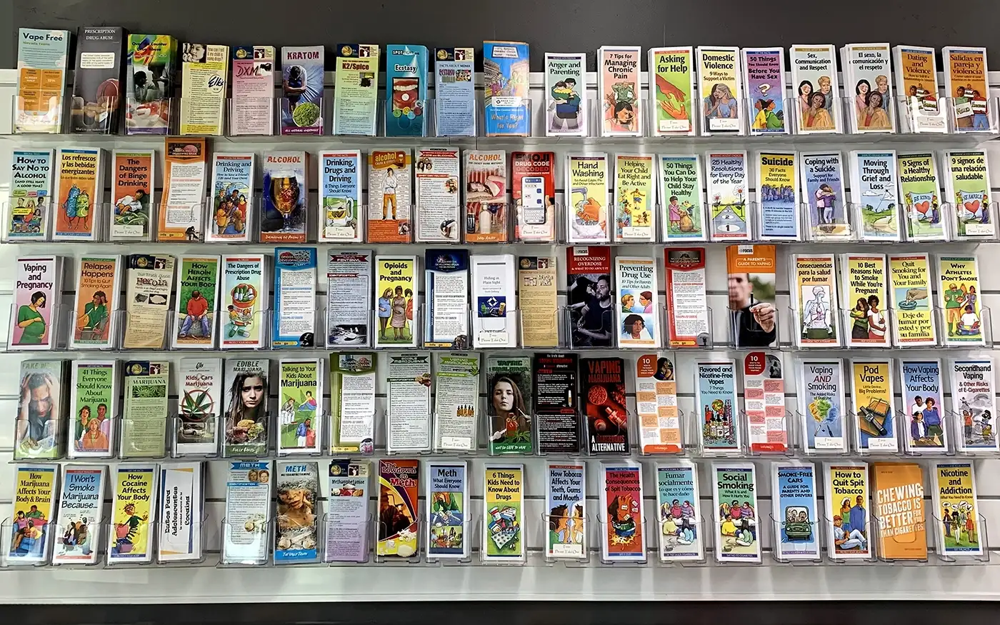A wall of various substance use prevention brochures.